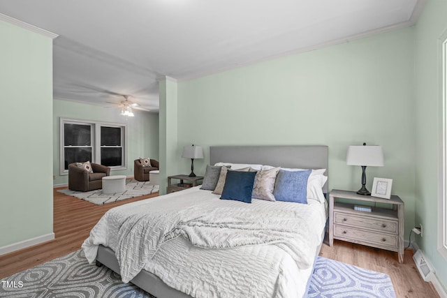 1408 Old Ivey Rd, Apex, NC 27523 - bedroom featuring wood finished floors, ornamental molding, and ceiling fan