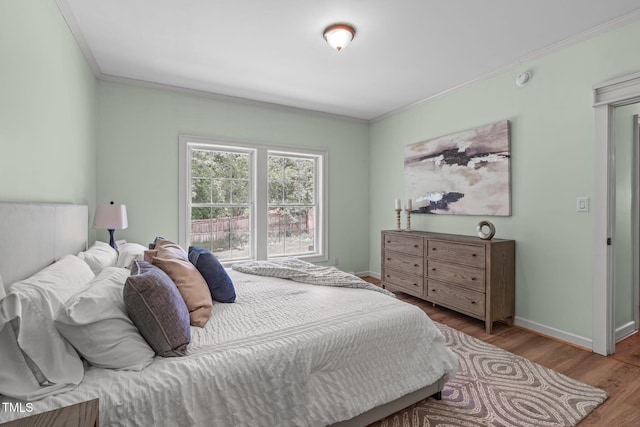 1408 Old Ivey Rd, Apex, NC 27523 - bedroom with ornamental molding and wood finished floors