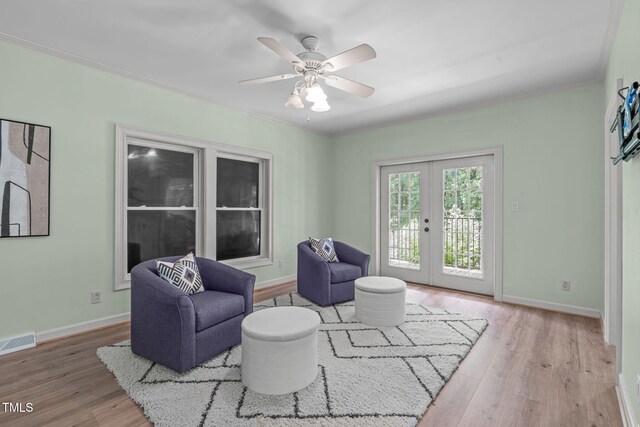 1408 Old Ivey Rd, Apex, NC 27523 - living room featuring wood finished floors, french doors, a ceiling fan, and crown molding