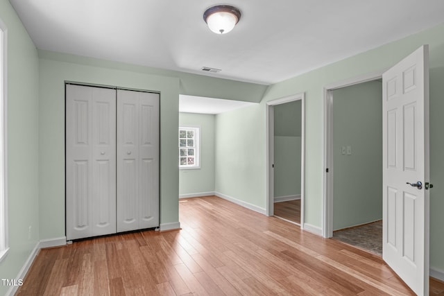 1408 Old Ivey Rd, Apex, NC 27523 - unfurnished bedroom with light wood-type flooring and a closet