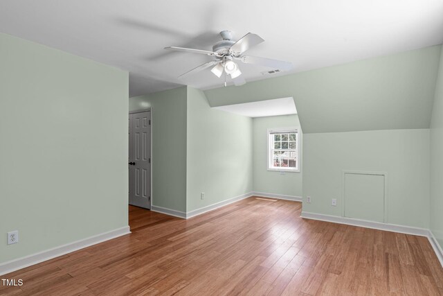 1408 Old Ivey Rd, Apex, NC 27523 - bonus room with a ceiling fan, wood finished floors, and vaulted ceiling