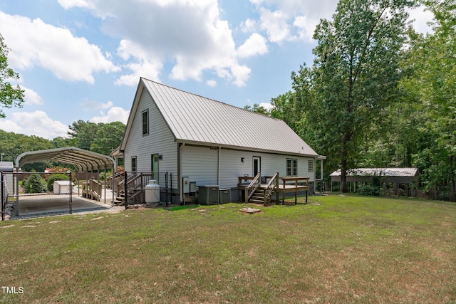 1408 Old Ivey Rd, Apex, NC 27523 - rear view of house featuring a detached carport, a deck, a metal roof, and stairway