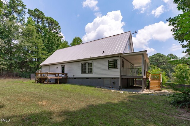 1408 Old Ivey Rd, Apex, NC 27523 - back of house featuring stairs, a deck, a lawn, and a metal roof