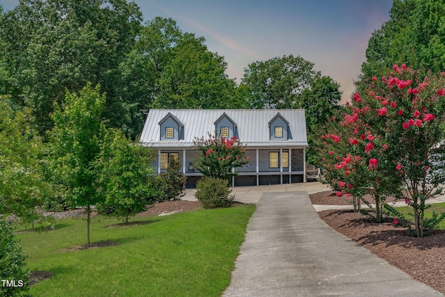 1408 Old Ivey Rd, Apex, NC 27523 - new england style home with a front lawn, a porch, driveway, and a metal roof