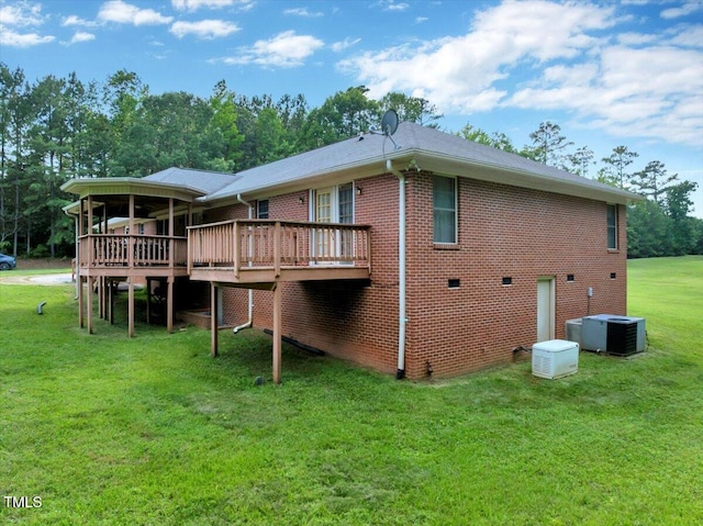 1379 Dr Martin Luther King Jr Blvd, Warrenton, NC 27589 - rear view of house with a deck, a yard, and brick siding