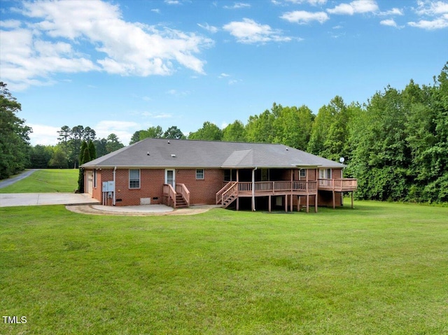 1379 Dr Martin Luther King Jr Blvd, Warrenton, NC 27589 - rear view of house with a yard, a wooden deck, and driveway