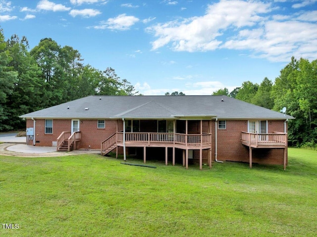 1379 Dr Martin Luther King Jr Blvd, Warrenton, NC 27589 - rear view of house featuring a wooden deck, a lawn, and brick siding
