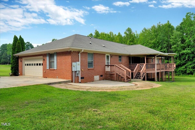 1379 Dr Martin Luther King Jr Blvd, Warrenton, NC 27589 - back of property with a garage, driveway, a lawn, brick siding, and crawl space