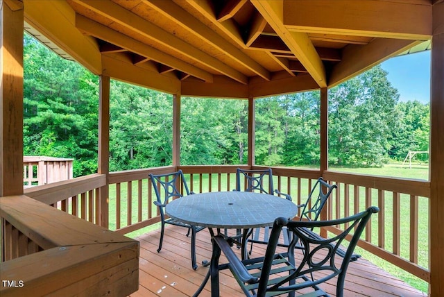 1379 Dr Martin Luther King Jr Blvd, Warrenton, NC 27589 - deck with outdoor dining space and view of wooded area