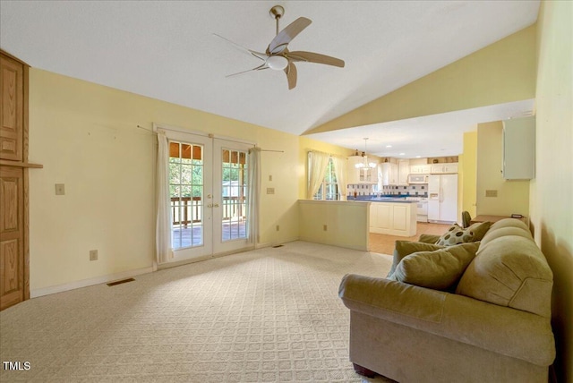 1379 Dr Martin Luther King Jr Blvd, Warrenton, NC 27589 - living room with french doors, lofted ceiling, a ceiling fan, and light colored carpet