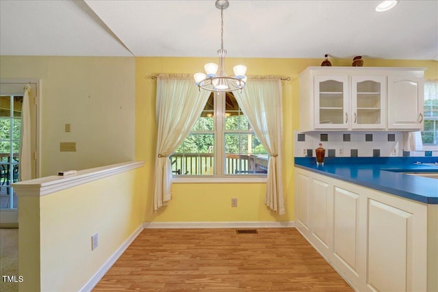 1379 Dr Martin Luther King Jr Blvd, Warrenton, NC 27589 - unfurnished dining area with a chandelier, light wood-type flooring, and recessed lighting