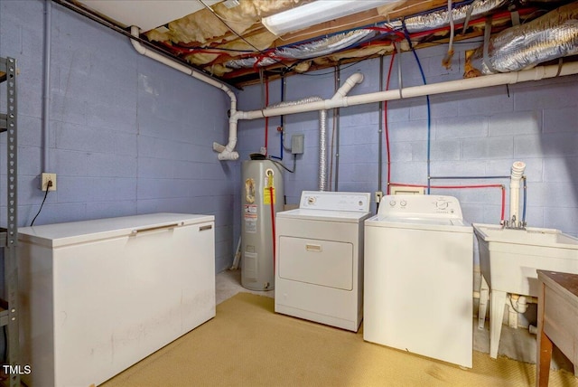 1379 Dr Martin Luther King Jr Blvd, Warrenton, NC 27589 - laundry area with separate washer and dryer, water heater, and concrete block wall