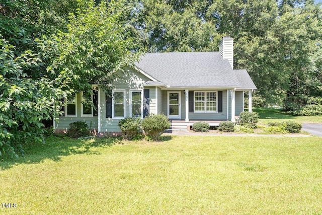 2474 Sumter Dr, Garner, NC 27529 - view of front facade featuring a porch, a front yard, a chimney, and roof with shingles