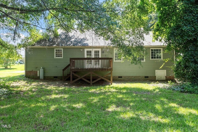 2474 Sumter Dr, Garner, NC 27529 - rear view of house with crawl space, a wooden deck, and a yard