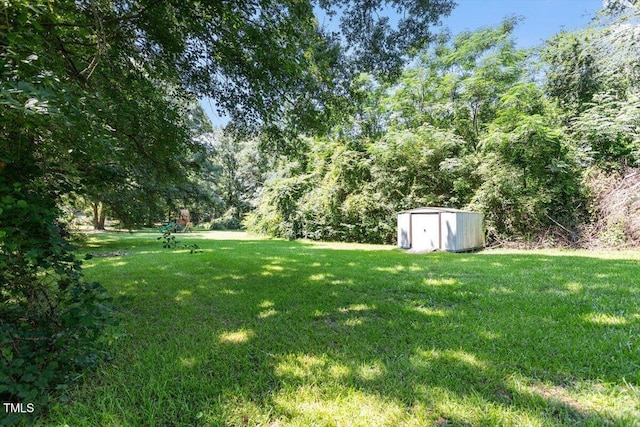 2474 Sumter Dr, Garner, NC 27529 - view of grassy yard featuring a storage unit