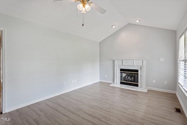 2474 Sumter Dr, Garner, NC 27529 - unfurnished living room with ceiling fan, wood finished floors, a fireplace, and high vaulted ceiling