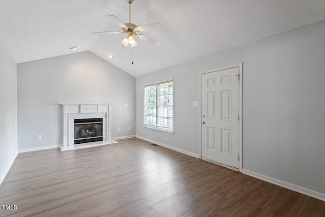 2474 Sumter Dr, Garner, NC 27529 - unfurnished living room with a ceiling fan, wood finished floors, a high end fireplace, and vaulted ceiling