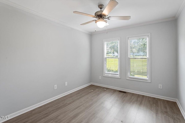 2474 Sumter Dr, Garner, NC 27529 - empty room with wood finished floors, a ceiling fan, and crown molding