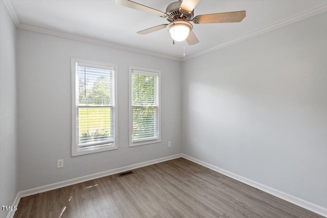 2474 Sumter Dr, Garner, NC 27529 - empty room with wood finished floors, ceiling fan, and ornamental molding