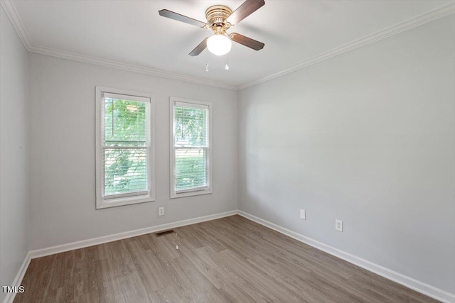 2474 Sumter Dr, Garner, NC 27529 - empty room with wood finished floors, ornamental molding, and ceiling fan