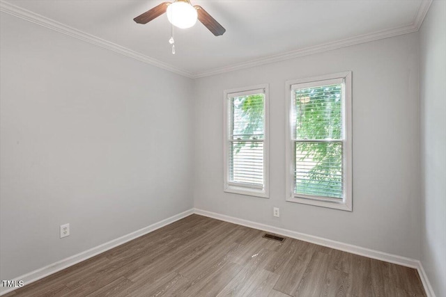 2474 Sumter Dr, Garner, NC 27529 - unfurnished room with wood finished floors, ornamental molding, and a ceiling fan