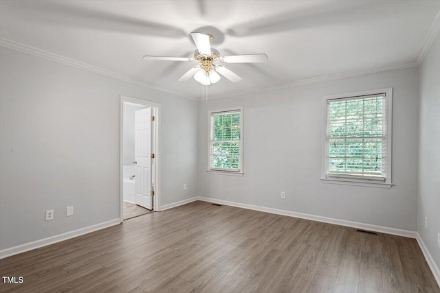 2474 Sumter Dr, Garner, NC 27529 - spare room featuring wood finished floors, ceiling fan, and ornamental molding