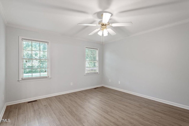 2474 Sumter Dr, Garner, NC 27529 - spare room with wood finished floors, ornamental molding, and a ceiling fan