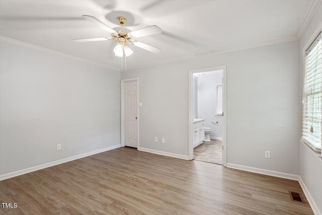 2474 Sumter Dr, Garner, NC 27529 - unfurnished bedroom with light wood finished floors, crown molding, connected bathroom, and a ceiling fan