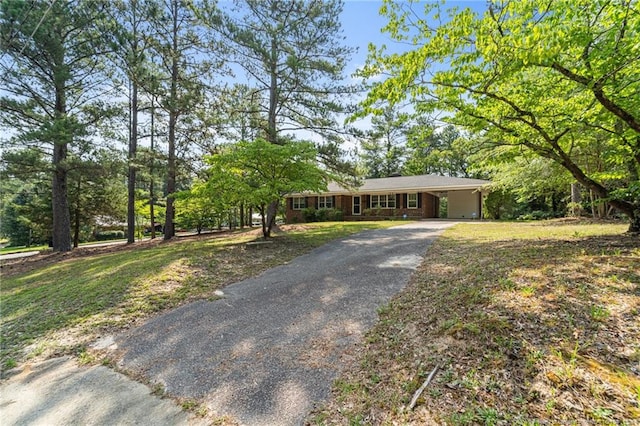 395 N Gaines St, Southern Pines, NC 28387 - single story home featuring driveway, a carport, and a front lawn