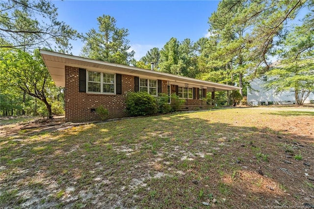 395 N Gaines St, Southern Pines, NC 28387 - view of front facade with brick siding and a front lawn