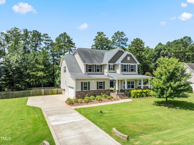 400 Swann Trl, Clayton, NC 27527 - craftsman-style house with concrete driveway, covered porch, a garage, stone siding, and roof with shingles