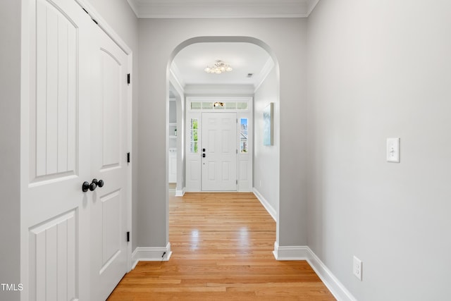 400 Swann Trl, Clayton, NC 27527 - foyer with arched walkways, light wood-style floors, and ornamental molding
