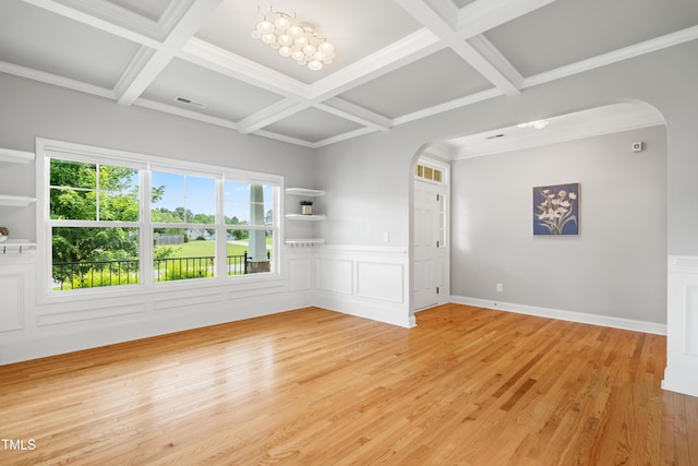 400 Swann Trl, Clayton, NC 27527 - empty room featuring arched walkways, coffered ceiling, light wood-type flooring, beamed ceiling, and a wainscoted wall