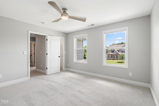 400 Swann Trl, Clayton, NC 27527 - unfurnished bedroom featuring light carpet and ceiling fan