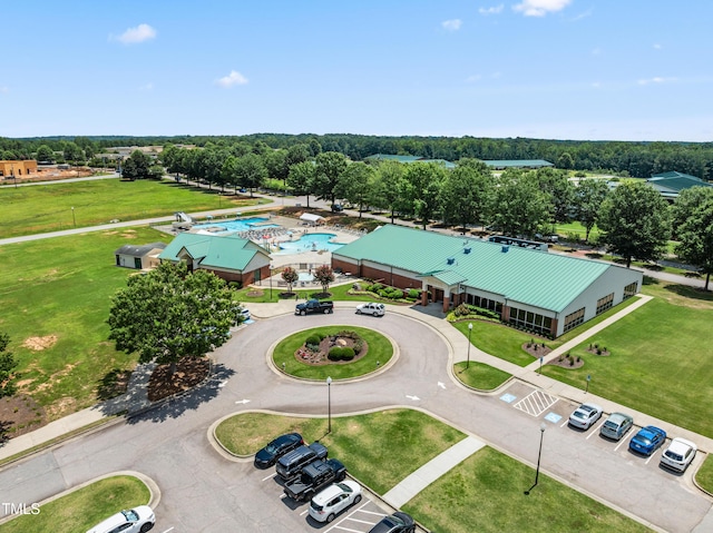400 Swann Trl, Clayton, NC 27527 - drone / aerial view of a pool area and a tree filled landscape