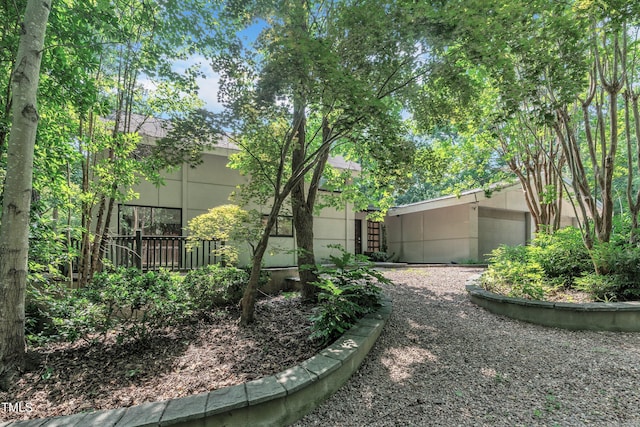8510 Dunlee Falls Rd, Raleigh, NC 27613 - view of yard featuring gravel driveway and an attached garage