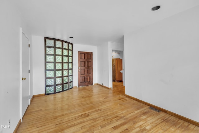 8510 Dunlee Falls Rd, Raleigh, NC 27613 - unfurnished room with light wood finished floors and expansive windows