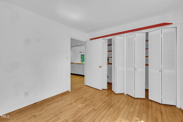 8510 Dunlee Falls Rd, Raleigh, NC 27613 - unfurnished bedroom featuring hardwood / wood-style flooring