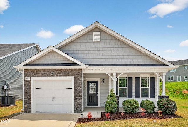 159 Forsyth Pkwy, Clayton, NC 27520 - view of front of property with covered porch, an attached garage, concrete driveway, and stone siding