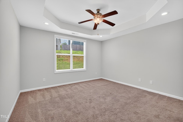 159 Forsyth Pkwy, Clayton, NC 27520 - unfurnished room with ceiling fan, carpet flooring, recessed lighting, and a tray ceiling