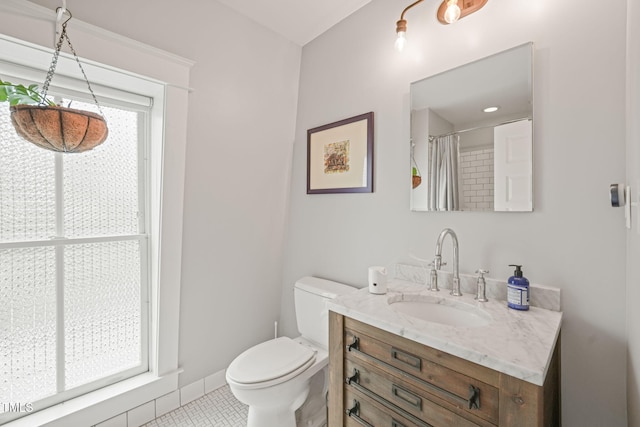 701 Holloway St, Durham, NC 27701 - full bath with vanity and tile patterned floors
