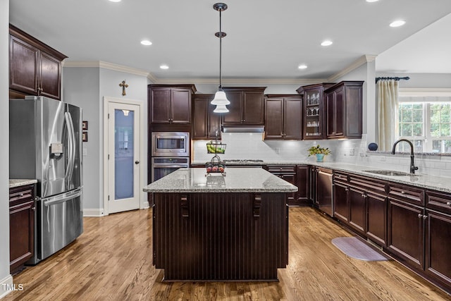 3036 Lawson Walk Way, Rolesville, NC 27571 - kitchen featuring stainless steel appliances, crown molding, under cabinet range hood, tasteful backsplash, and light stone counters