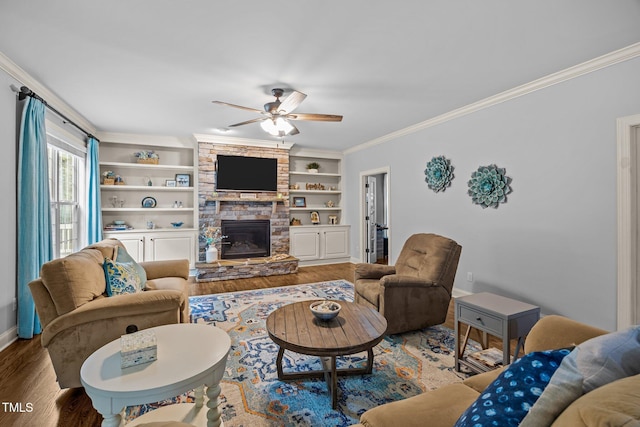 3036 Lawson Walk Way, Rolesville, NC 27571 - living area featuring wood finished floors, a ceiling fan, crown molding, a fireplace, and built in features