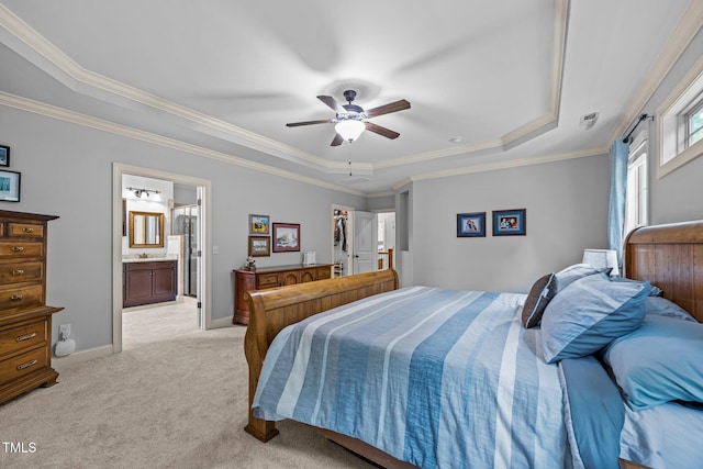 3036 Lawson Walk Way, Rolesville, NC 27571 - bedroom featuring a raised ceiling, light colored carpet, ornamental molding, connected bathroom, and ceiling fan