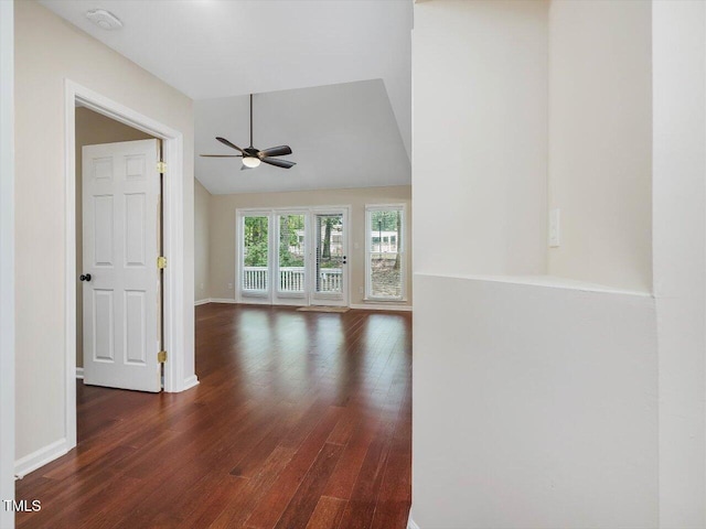 3811 Carnegie Ln, Raleigh, NC 27612 - unfurnished room with ceiling fan, dark wood-style floors, a smoke detector, and vaulted ceiling