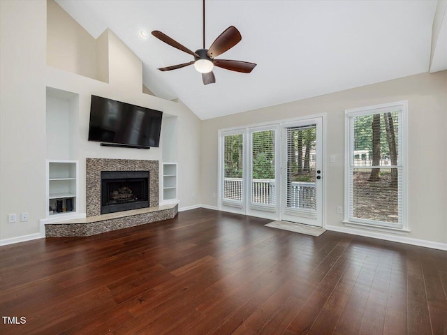 3811 Carnegie Ln, Raleigh, NC 27612 - unfurnished living room with ceiling fan, dark wood-type flooring, healthy amount of natural light, a premium fireplace, and high vaulted ceiling