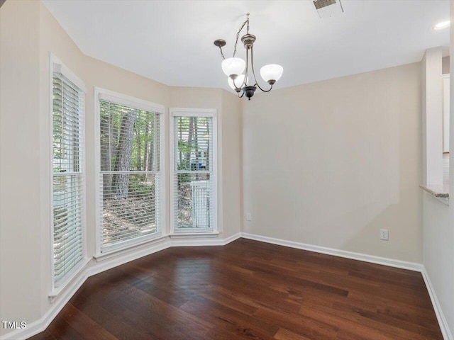 3811 Carnegie Ln, Raleigh, NC 27612 - unfurnished room with wood finished floors and a chandelier