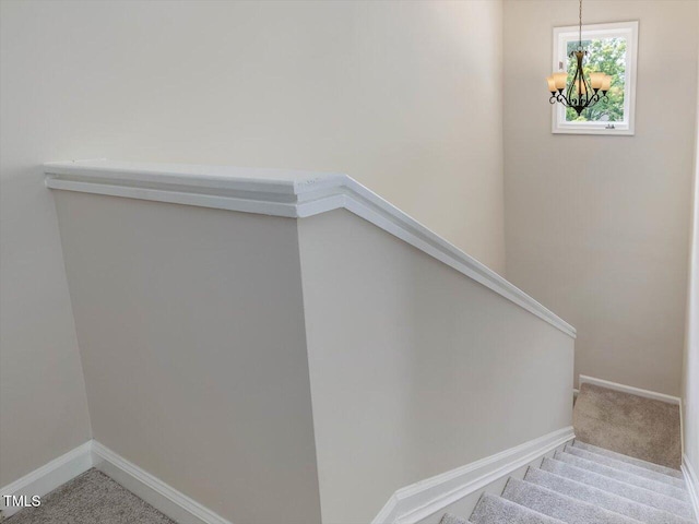 3811 Carnegie Ln, Raleigh, NC 27612 - stairs with a chandelier and carpet flooring