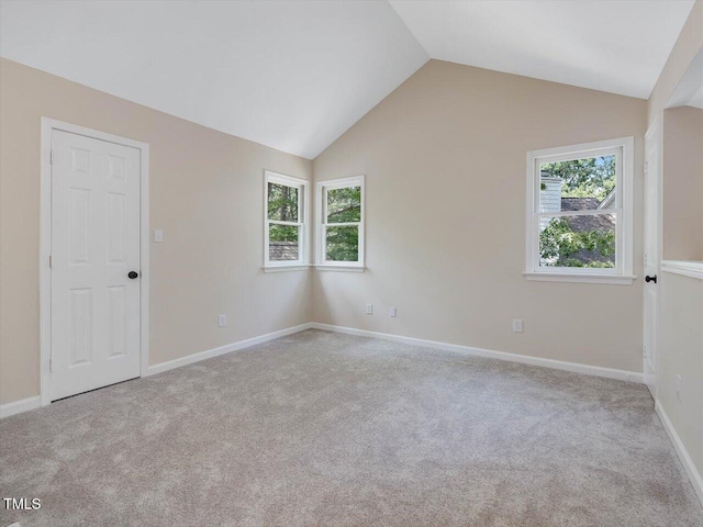 3811 Carnegie Ln, Raleigh, NC 27612 - spare room featuring healthy amount of natural light, lofted ceiling, and carpet