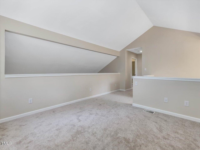 3811 Carnegie Ln, Raleigh, NC 27612 - additional living space with vaulted ceiling and carpet flooring